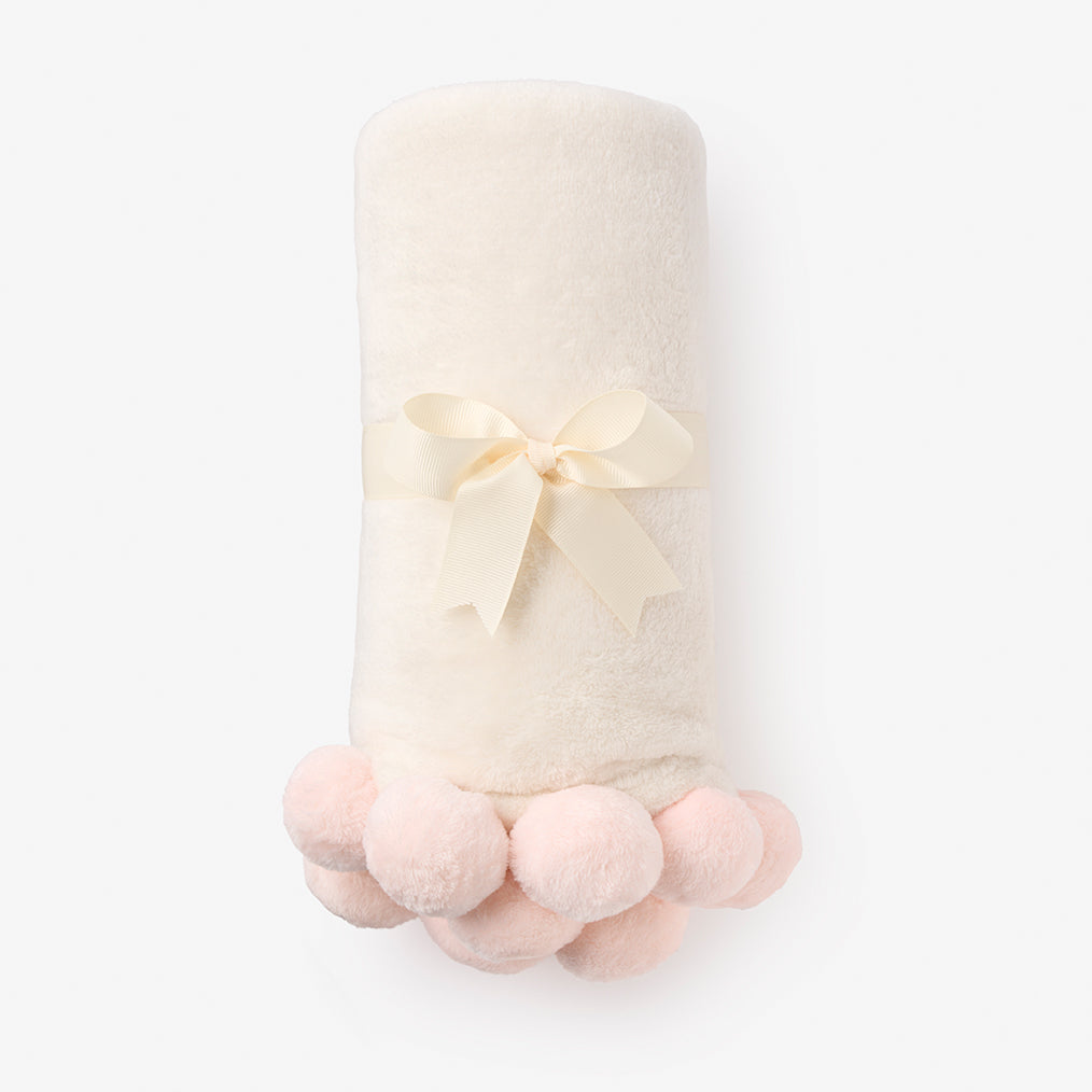 Cream pom pom online blanket