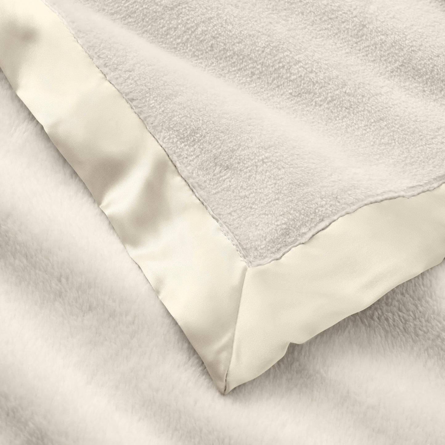 zoomed in Cream Satin Trim Flannel Fleece Baby Stroller Blanket view 5