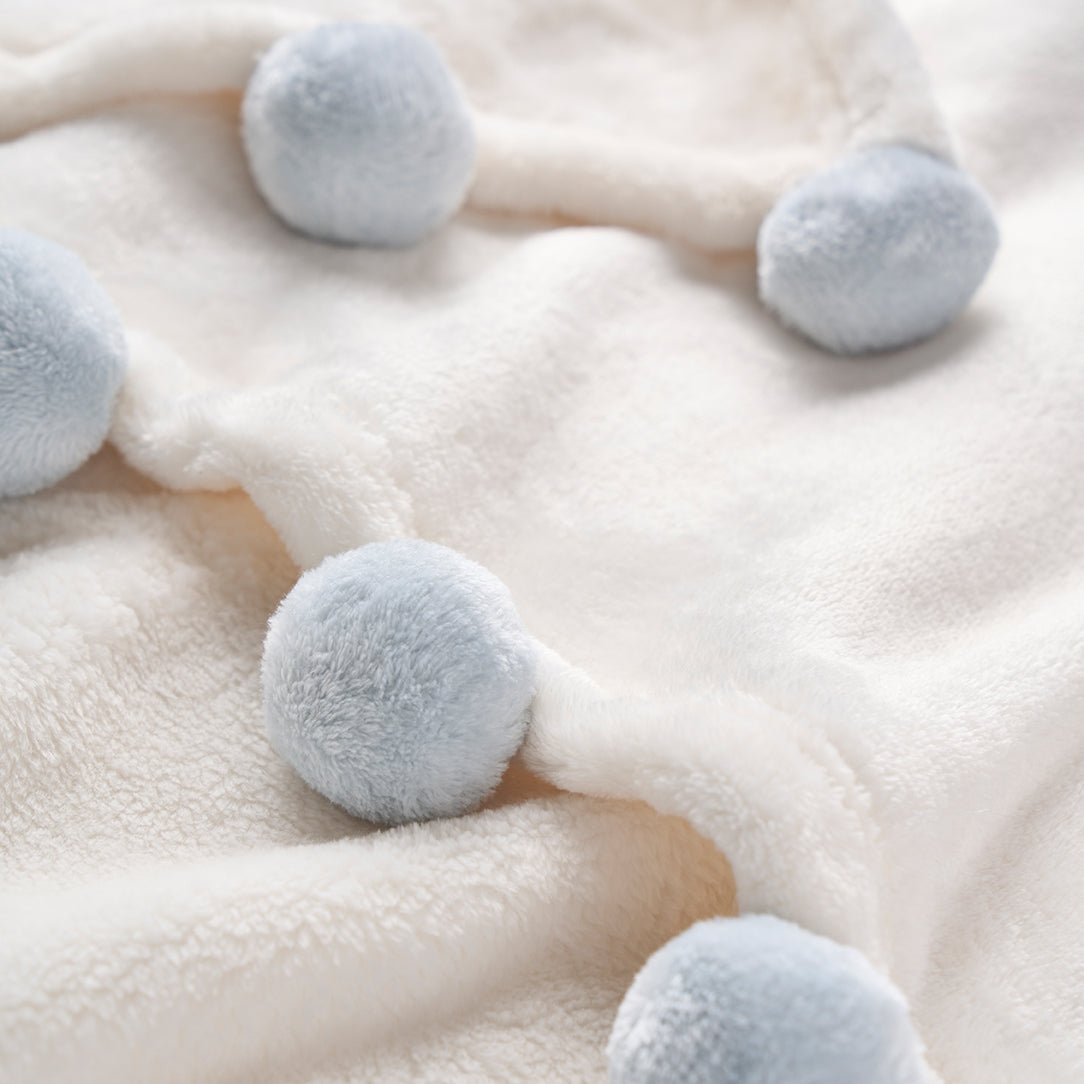 White pom pom online baby blanket