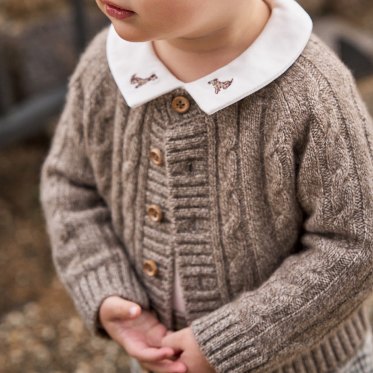zoomed in Marled Brown 100% Cashmere Knit Baby Cardigan view 2